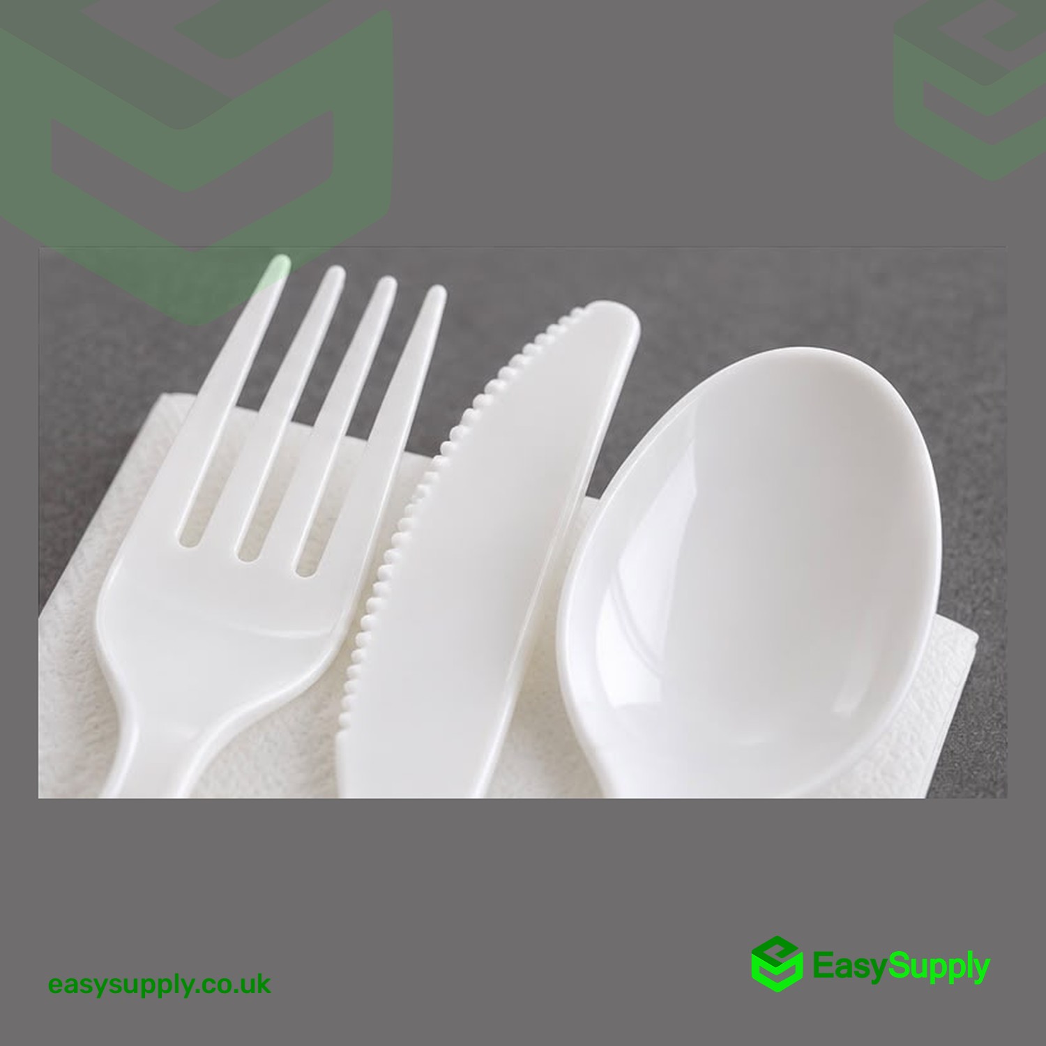 Close-up of the white PP fork, serrated knife and spoon on the napkin